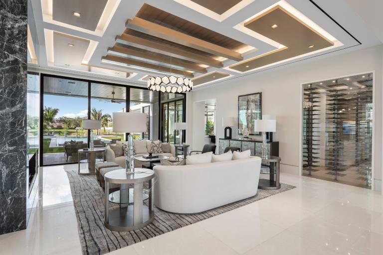 Glass-enclosed wine room designed and installed by Luxury Glass Systems